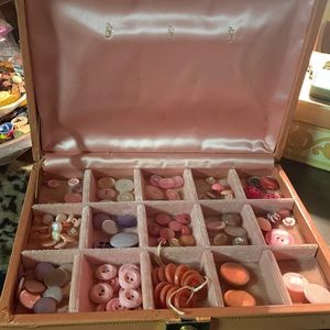 Vintage jewelry box with over 100 pinky color buttons